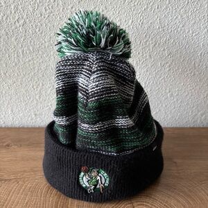 Boston Celtics New Era Black White Stripe Cuffed Pom Knit Hat